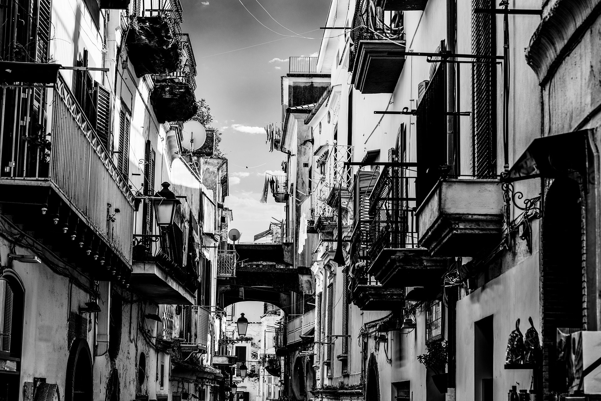 Naples street Black-and-white photograph of a narrow Naples street with balconies